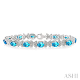 Sterling Silver Round Cut Diamond and Oval Cut Blue Topaz Bracelet