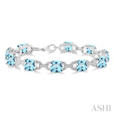 Sterling Silver Blue Topaz and Diamond Bracelet, 0.05 Carat Dia. TW