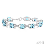 Sterling Silver Blue Topaz and Diamond Bracelet, 0.05 Carat Dia. TW