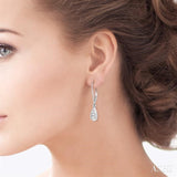 1/8 Ctw Pear Shape Round Cut Diamond Earrings in 14K White Gold
