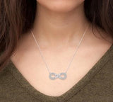 10K White Gold Diamond Round and Baguette Infinity Necklace, 0.20 Carat TW