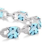 Sterling Silver Blue Topaz and Diamond Bracelet, 0.05 Carat Dia. TW