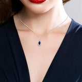 10KW Diamond and Sapphire Pendant w/ 0.07 ctw & 18"